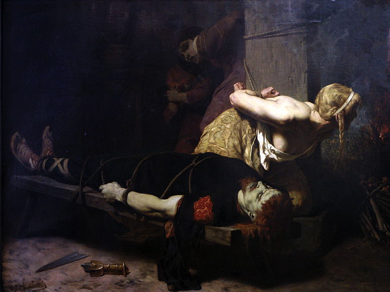 Le cadavre de Chramm étranglé et son épouse attachée à un poteau. Elle a été condamnée ainsi que ses deux filles (dans l’ombre) à périr par le feu mis à la masure dans laquelle elles sont enfermées. LUMINAIS Evariste Vital (1822-1896), La mort de Chramm, 1879, H/T, 2x1,5m, Brest , MBA, n°200-6-1